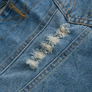 Men's slim fit blue denim vest featuring vintage distressed holes and yellow stitching