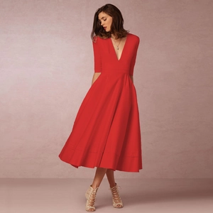 Elegant red V-neck midi dress with short sleeves and a flowing pleated skirt for gala events