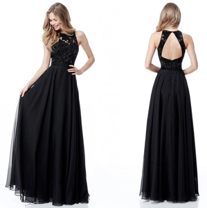 Detail of black evening gown featuring sequined floral bodice and open back design