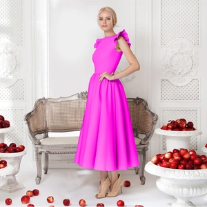 Detail of elegant ruffled shoulders on a hot pink cocktail midi dress for women