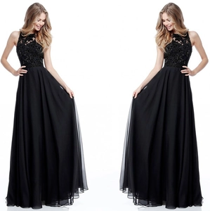 Detail of elegant black lace bodice with sequins and flowing chiffon skirt on gown