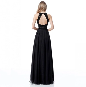 Detailed back view of a black evening gown featuring intricate lace bodice and open back cutout