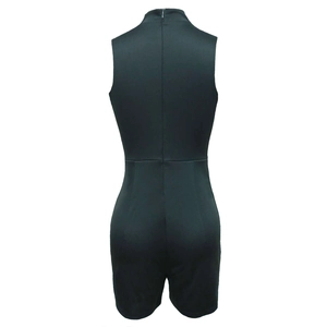 Detail view of the back showing a high neck cut and invisible zipper on solid color romper