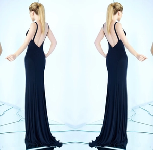 Detailed back view of a slim-fit black mermaid dress with elegant open back and thin straps