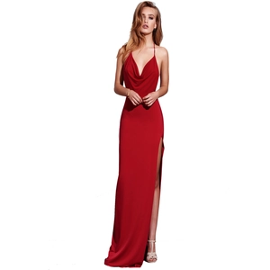 Detail of red cowl neck evening gown with spaghetti straps and high side slit