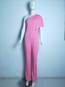 Close-up of pink one-shoulder jumpsuit with layered ruffles and wide-leg trousers