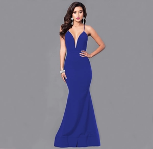 Detail of elegant dark blue evening dress with cross straps and deep V-neck mermaid hem