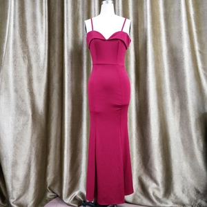Detail view of the sleek V-neckline and slender straps on this burgundy mermaid evening gown