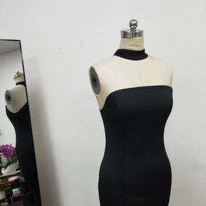 Detail of elegant black strapless mermaid evening dress with matching neck choker accessory