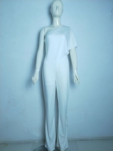 Detail of white one-shoulder jumpsuit featuring elegant pleated bodice and draped fabric