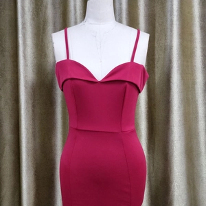 Detail of rose red bodycon dress with sweetheart neckline and ruched foldover bodice