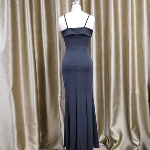 Detailed view of black off-the-shoulder evening dress with ruffled back and slim mermaid cut