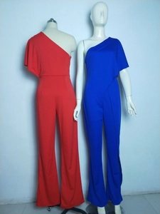 Detail view of one-shoulder jumpsuit with ruffled sleeve in red and royal blue colors