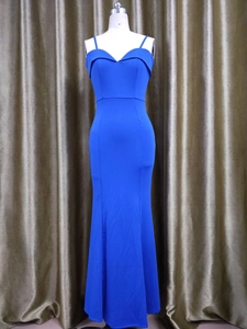 Detailed view of the off-shoulder neckline and royal blue fishtail evening gown hem