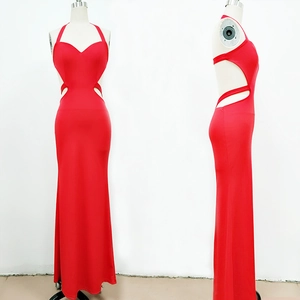 Detail of red halter neck evening gown showing waist cut-out and backless design