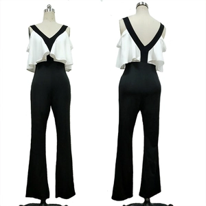 Elegant black and white jumpsuit featuring ruffle sleeves and a wide-leg pant design