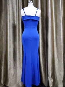 Detail of royal blue off-shoulder evening gown with slender straps and fishtail hemline