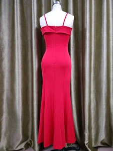Detail of red slim fit evening dress featuring thin straps and elegant back neckline fold