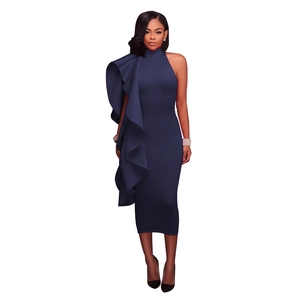 Detail of elegant navy blue ruffles on a slim fit evening dress with a halter neckline