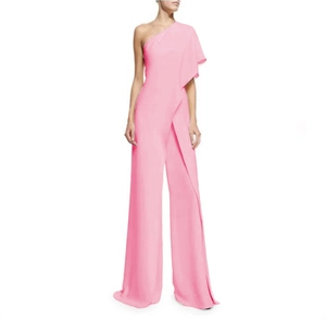 Detailed view of pink one-shoulder jumpsuit with ruffled sleeve and wide-leg trousers