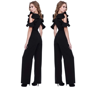 Detail of elegant black off-shoulder jumpsuit with layered ruffles and wide leg cut
