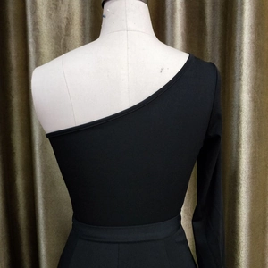 Detailed back view of a black one-shoulder jumpsuit featuring a slim fit and waist contour