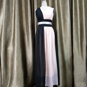 Detail of V-neck sleeveless chiffon maxi dress with black and pink color block design