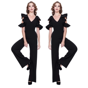 Detail of elegant black jumpsuit featuring deep V-neckline and layered ruffles on shoulders