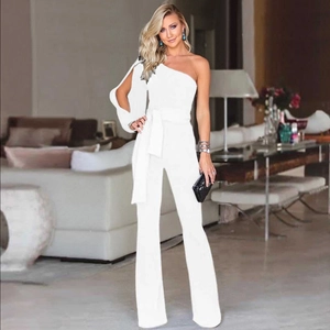 Detail of white one-shoulder jumpsuit with asymmetric long sleeve and wide waist belt tie