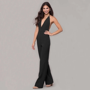 Elegant black halter neck wide leg jumpsuit with deep V-neck and open back design