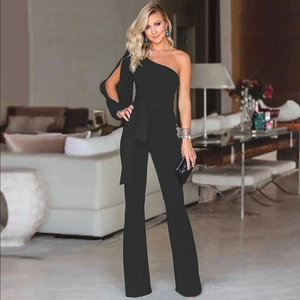 Detail of the high-waisted flared leg cut on this one-shoulder elegant black jumpsuit
