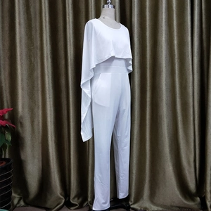 Detail of white cape jumpsuit with crew neck and straight leg pants on mannequin
