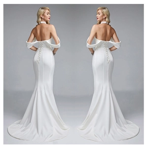 Elegant white mermaid evening gown with backless lace-up detail and off-shoulder bow