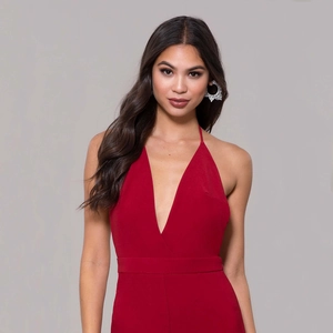 Elegant red deep V-neck halter jumpsuit for women featured in a full-body studio portrait