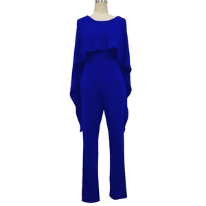 Detail of royal blue jumpsuit featuring an elegant cape overlay and high-waist straight fit