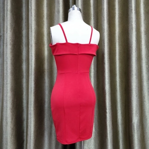 Detail view of the back of a red bodycon dress featuring hidden zipper and thin straps