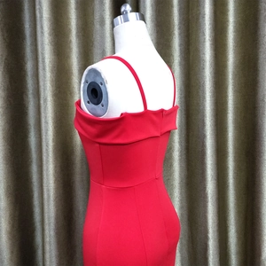 Detail view showing invisible back zipper and shoulder straps on a red bodycon dress