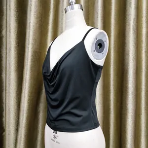 Detailed view of black cowl neck camisole top with elegant draped silk fabric texture
