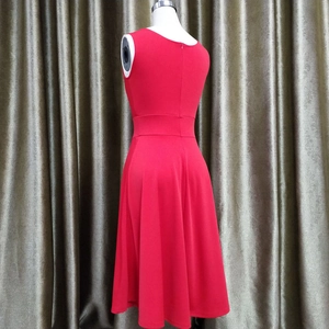 Close-up of the red sleeveless A-line cocktail dress showing the back hidden zipper detail