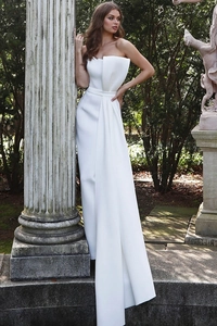 Detail of white strapless evening dress with 3D pleated neckline and slim waist belt