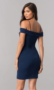 Detail of the hidden back zipper and slim fit tailoring on a navy evening dress