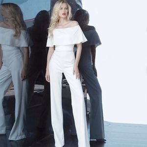 Detailed view of white off-the-shoulder jumpsuit with elegant high-waist wide-leg fit
