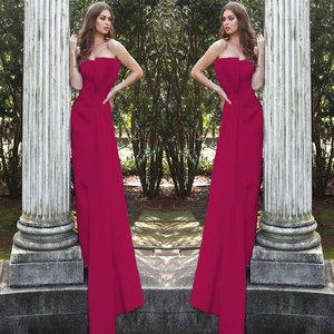 Detail of the elegant rose red strapless evening jumpsuit with floor-length pleated design