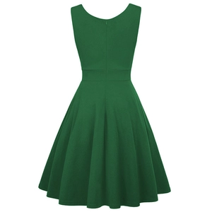 Back view of a vintage dark green cocktail dress with an invisible zipper and A-line silhouette