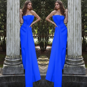 Detail of elegant royal blue strapless jumpsuit evening gown with floor length silhouette