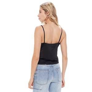 Back view of black spaghetti strap camisole in stretch fabric with denim jeans