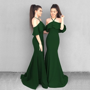 Deep green mermaid evening gown with halter ruffle sleeves and floor-length fishtail hem