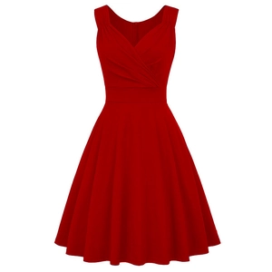 Detail view of red V-neck sleeveless cocktail dress with pleated bust and flared A-line skirt