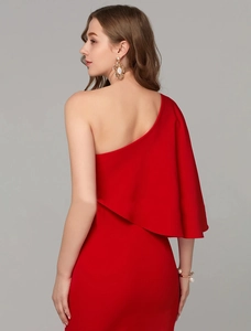 Detail of red one-shoulder evening gown featuring ruffled neckline and smooth texture
