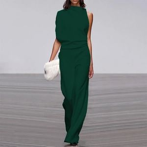 Detail view of dark green sleeveless jumpsuit featuring a high neck and wide-leg design
